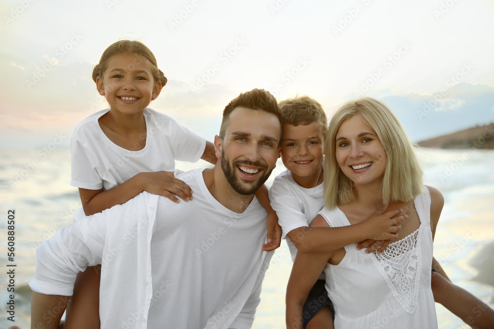 Happy family on beach near sea. Summer vacation Happy family on beach near sea. Summer vacation