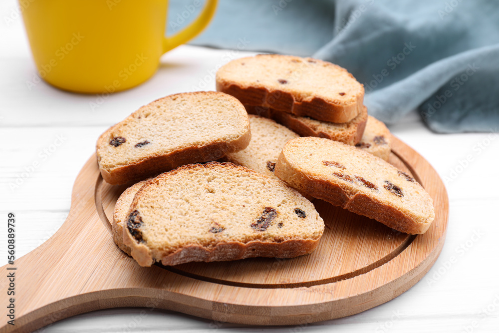 Sweet hard chuck crackers with raisins on white wooden table Sweet hard chuck crackers with raisins on white wooden table