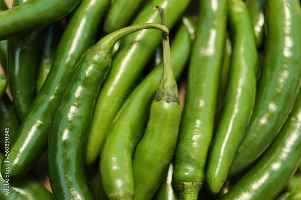Green hot chili peppers as background, closeup Green hot chili peppers as background, closeup