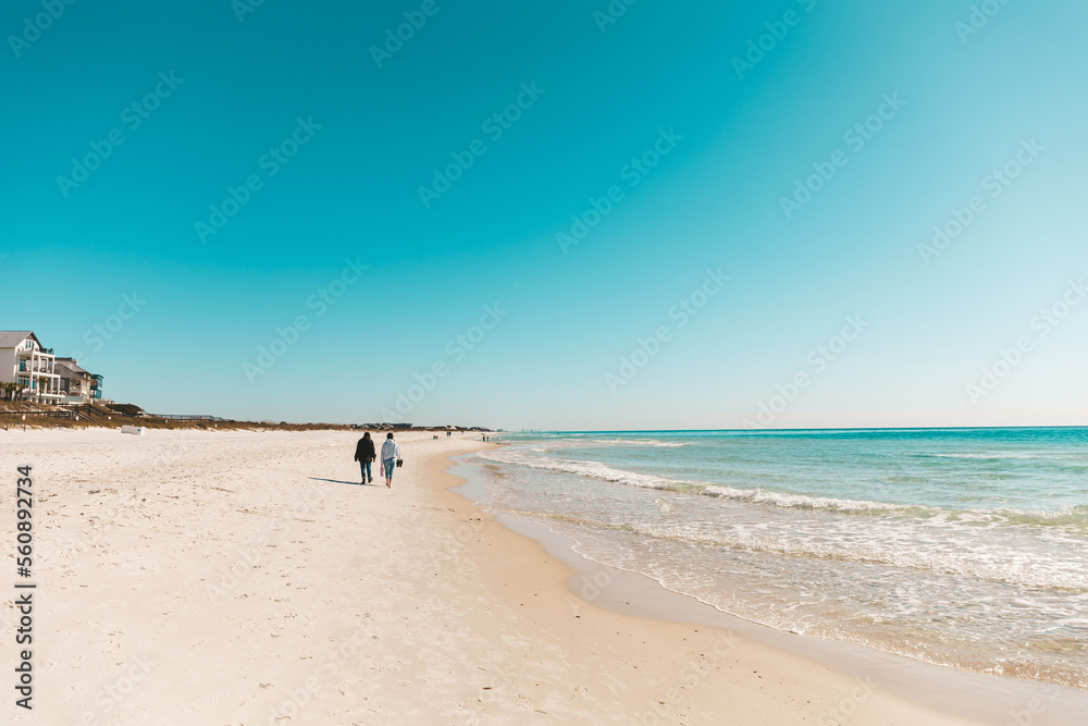 person walking on the beach