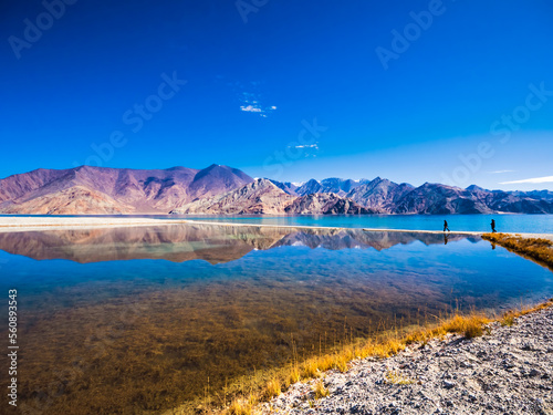 Reflection in Pangong lake and mountains in Ladakh, India