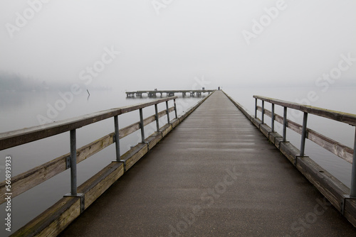 Dock surrounded by heavy fog in winter in Bothell  WA 