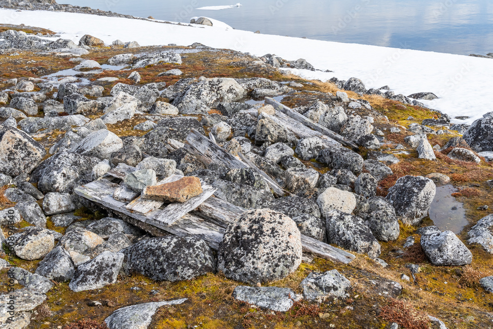 Ancient coffin at gravesite in Svalbard, Norway on the Arctic Sea. Over 100 years old. Ancient coffin at gravesite in Svalbard, Norway on the Arctic Sea. Over 100 years old.
