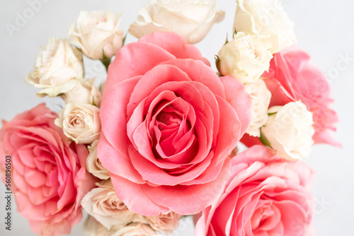 Coral roses and blush pink spray roses 