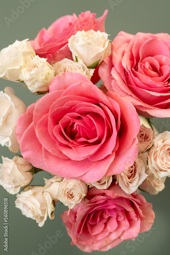 Coral roses and blush pink spray roses 