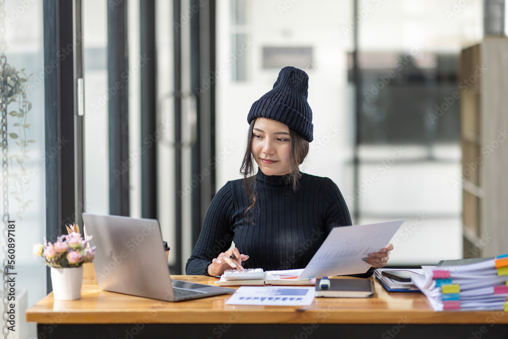 Business freelance Asian woman working at office with documents on her desk, doing planning analyzing the financial report, business plan investment, finance analysis concept