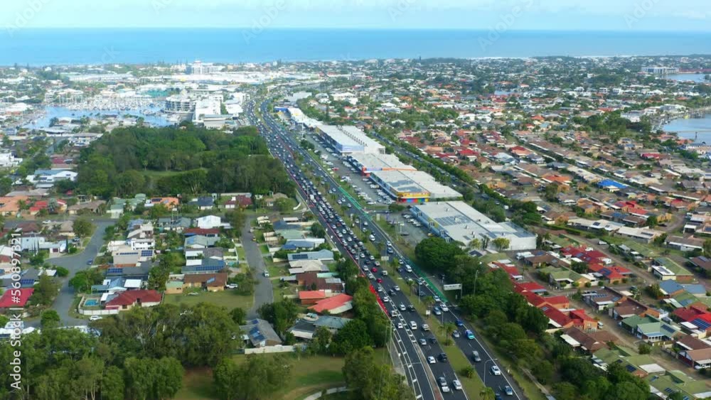 Aerial Drone Flyover Busy Coastal Road With Traffic And Ocean Views On Horizon, 4K