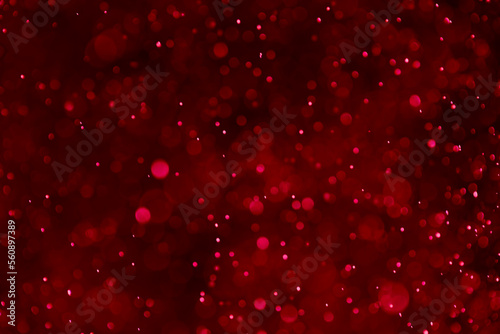 Valentine’s on dark red bokeh glitter background Ideal as wallpaper, card,wedding, Christmas theme, brochure etc.,