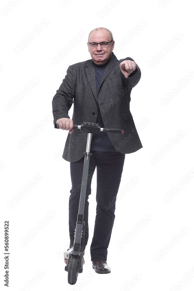 full growth . Mature business man with an electric scooter full growth . Mature business man with an electric scooter