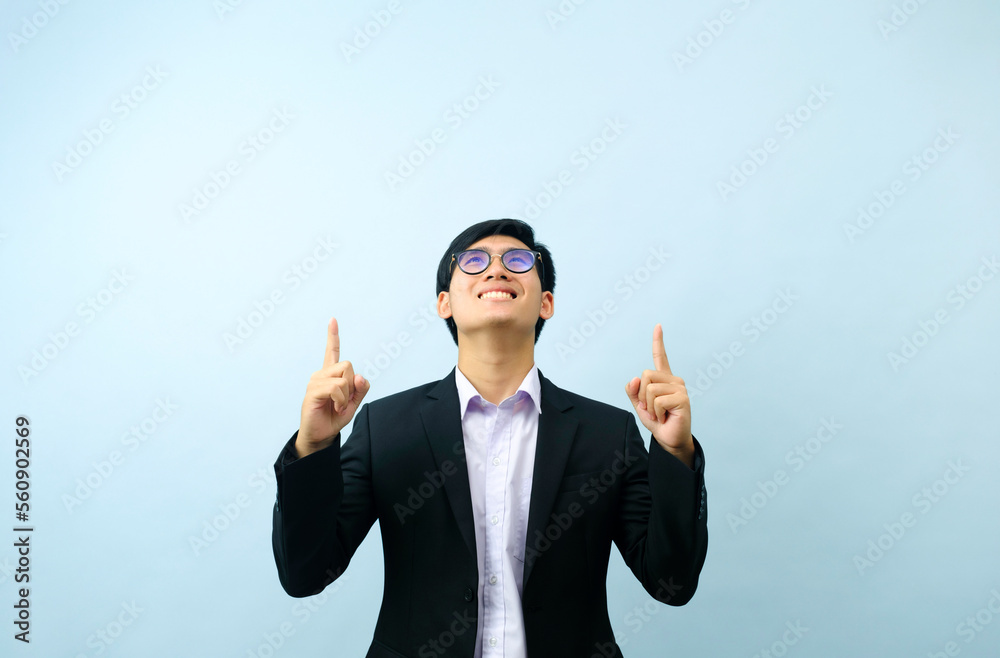 Portrait of businessman looking and pointing up. Portrait of businessman looking and pointing up.