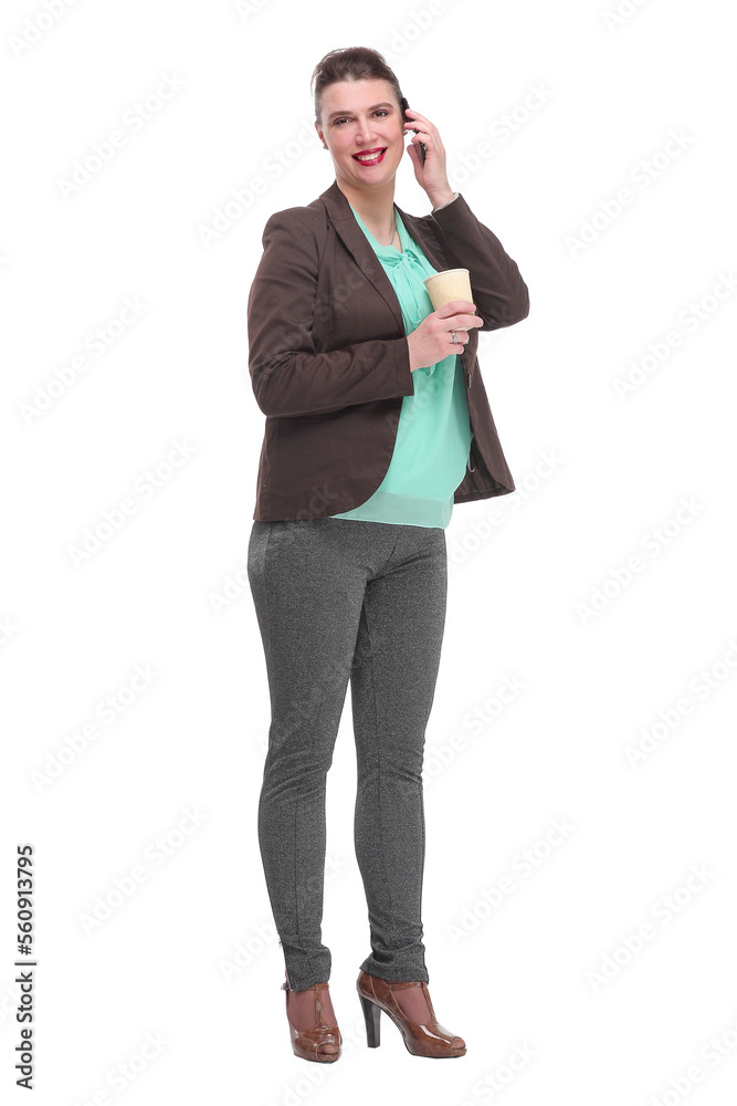 Portrait of a cheerful laughing businesswoman in suit holding take away coffee cup while talking on mobile phone Portrait of a cheerful laughing businesswoman in suit holding take away coffee cup while talking on mobile phone