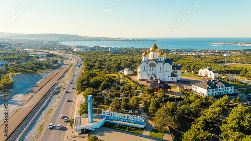 Gelendzhik, Russia. Cathedral of St. Andrew the First-Called. The text along the M4-Don Highway is translated: Glory to Russia, Kuban-Pearl of Russia. Gelenzhik-City Resort, Aerial View