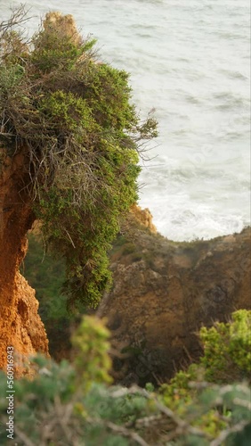 Athlantic Ocean waves in Portugal breacking agains the rocks and cliffs ( in Roca Cape in Portugal) photo