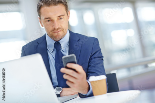 Thinking, corporate or business man with phone in office for communication, social networking or content blog review. Laptop or manager with smartphone for social media, mobile or web app search
