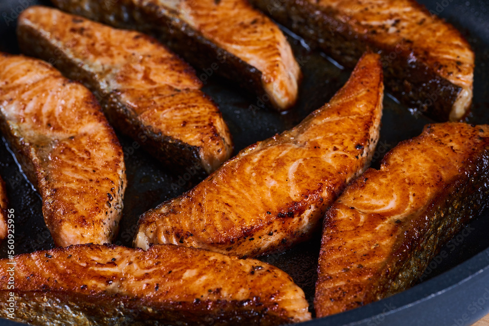 Salmon fillets in the frying pan