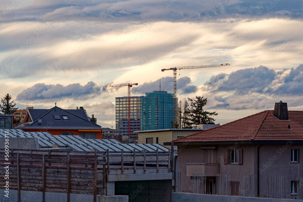 Highway enclosure construction site at City of Zürich district Schwamendingen with apartment buildings on a cloudy autumn afternoon. Photo taken November 17th, 2022, Zurich, Switzerland. Highway enclosure construction site at City of Zürich district Schwamendingen with apartment buildings on a cloudy autumn afternoon. Photo taken November 17th, 2022, Zurich, Switzerland.