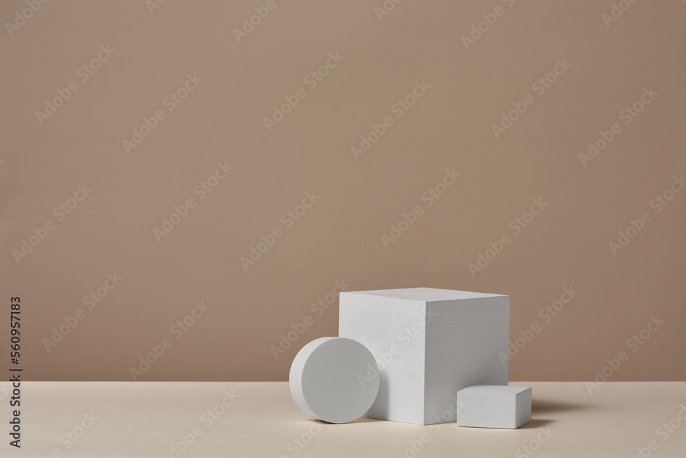 white podium for product demonstration on a light brown background white podium for product demonstration on a light brown background