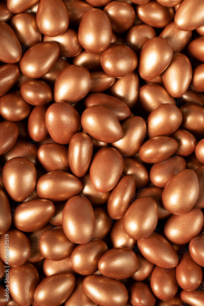 Chocolate dragee in the form of a pile. Brown dragee chocolate with chocolate filling. Top view. close up Chocolate dragee in the form of a pile. Brown dragee chocolate with chocolate filling. Top view. close up