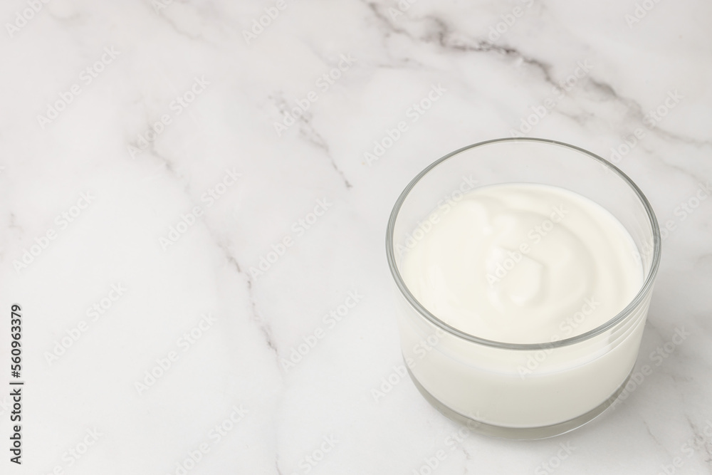 Creamy natural yogurt on a light background, Probiotic cold fermented dairy drink. Long banner format. top view Creamy natural yogurt on a light background, Probiotic cold fermented dairy drink. Long banner format. top view