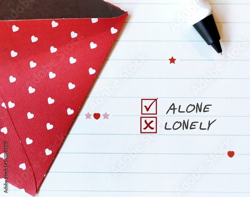 Sweet heart red letter with text written and checkbox yes to ALONE and no to LONELY, concept of person happy with singlehood, content and find peace in solitude, will never feeling lonely photo