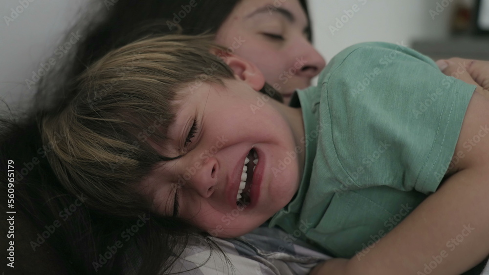 Tearful crying child. Mother consoling sad little boy. Kid in crisis cries Tearful crying child. Mother consoling sad little boy. Kid in crisis cries
