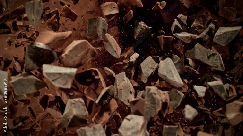 Super Slow Motion Shot of Rotating Raw Chocolate Chunks and Cocoa after Being Exploded at 1000fps. Super Slow Motion Shot of Rotating Raw Chocolate Chunks and Cocoa after Being Exploded at 1000fps.