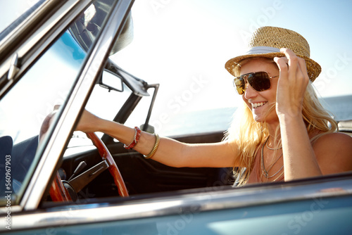 Travel, road trip and woman in car in summer for holiday, adventure and freedom on vacation by ocean. Travelling lifestyle, happiness and girl driving in motor vehicle for relaxing, break and journey
