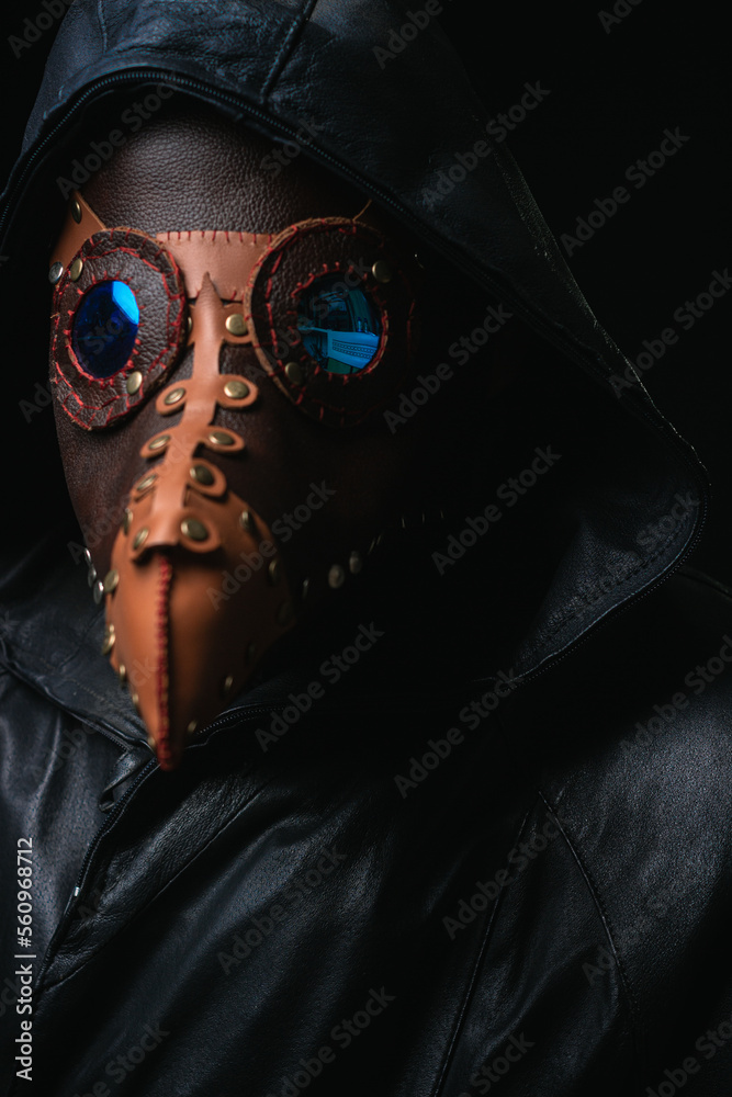 Plague doctor with crow-like mask isolated on black background Creepy halloween historical terrible costume concept Epidemic covid smallpox monkeypox Plague doctor with crow-like mask isolated on black background Creepy halloween historical terrible costume concept Epidemic covid smallpox monkeypox