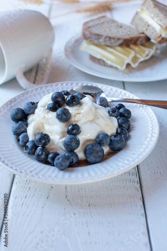 Low fat breakfast with yogurt, berries and quark cheese sandwich