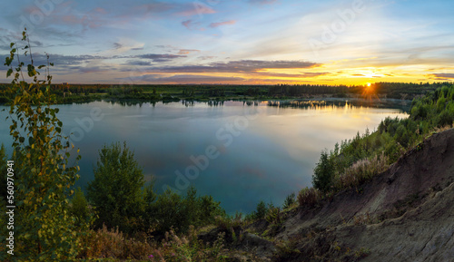 Sunset over the horizon and at the water quarry . Leningrad region. Vsevolozhsk. © amarinchenko106