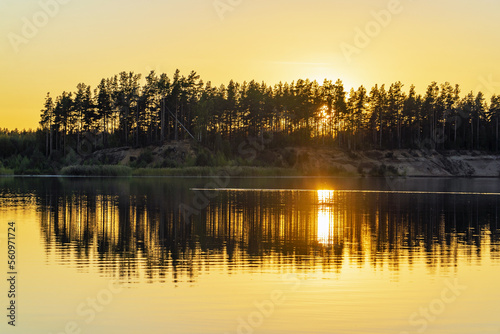 Sunset over the horizon and at the water quarry . Leningrad region. Vsevolozhsk.