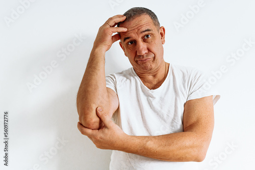 Canvas-taulu portrait of attractive middle-aged with emotion of doubt and disbelief