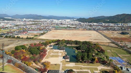 Gyeongju: Aerial view of city in South Korea, Donggung Palace & Wolji Pond, trees in autumn colors - landscape panorama of East Asia from above photo