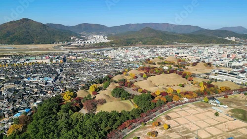 Gyeongju: Aerial view of city in South Korea, Daereungwon Tomb Complex, trees in autumn colors - landscape panorama of East Asia from above photo