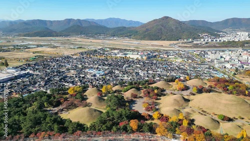 Gyeongju: Aerial view of city in South Korea, Daereungwon Tomb Complex, trees in autumn colors - landscape panorama of East Asia from above photo