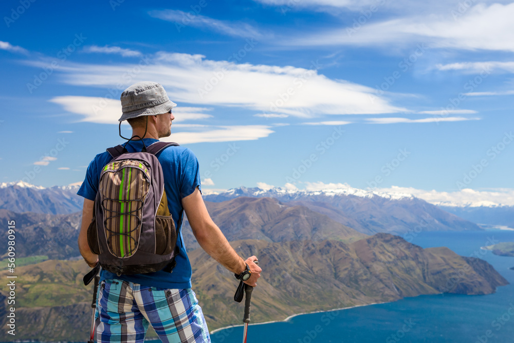 Tourist with a backpack and mountain panorama
