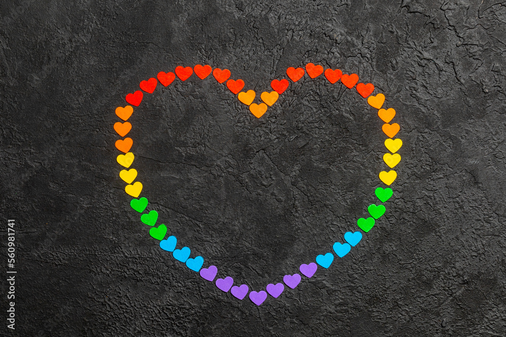Rainbow heart on a black background. Hearts in the colors of the LGBT flag