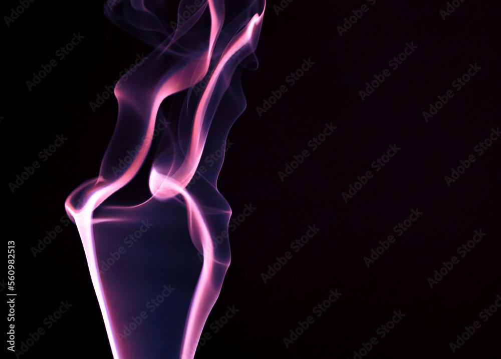 Colored smoke on a black background.Abstract streaks from smoke. Colored smoke on a black background.Abstract streaks from smoke.