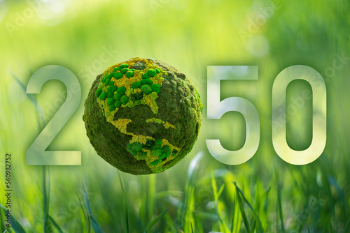 Numbers 2050 with green planet. A symbol of sustainable development and full transition to renewable energy by 2050 year.	 photo