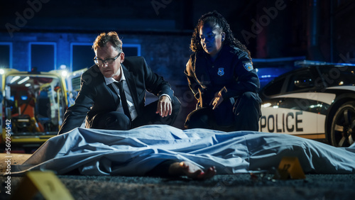 Φωτογραφία Team of Two Multiethnic Police Officers Working on Profiling a Killer on the Loose