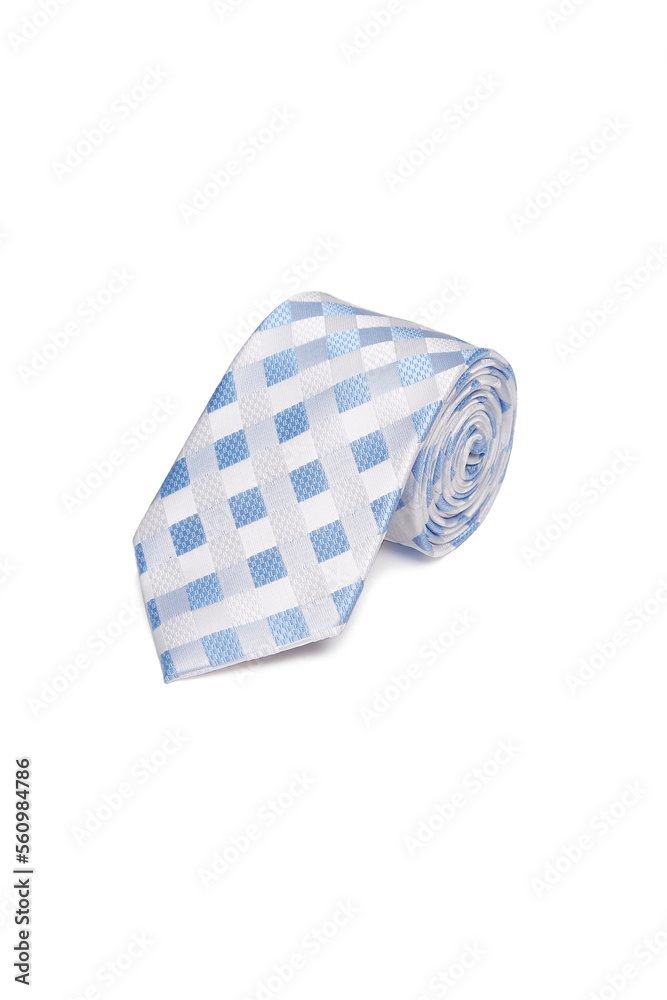 Close-up shot of an elegant light-colored tie with a blue and white geometric checked pattern. The classic checkered necktie is rolled and isolated on a white background. Top view. Close-up shot of an elegant light-colored tie with a blue and white geometric checked pattern. The classic checkered necktie is rolled and isolated on a white background. Top view.