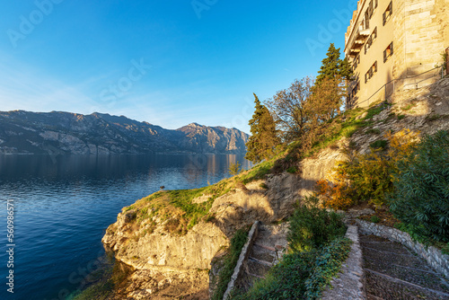 Fototapeta Naklejka Na Ścianę i Meble -  Panoramic view of Lake Garda (Lago di Garda) and Italian Alps, from the small town of Malcesine, Verona province, Italy, Veneto, southern Europe. On background the coast of Lombardy.