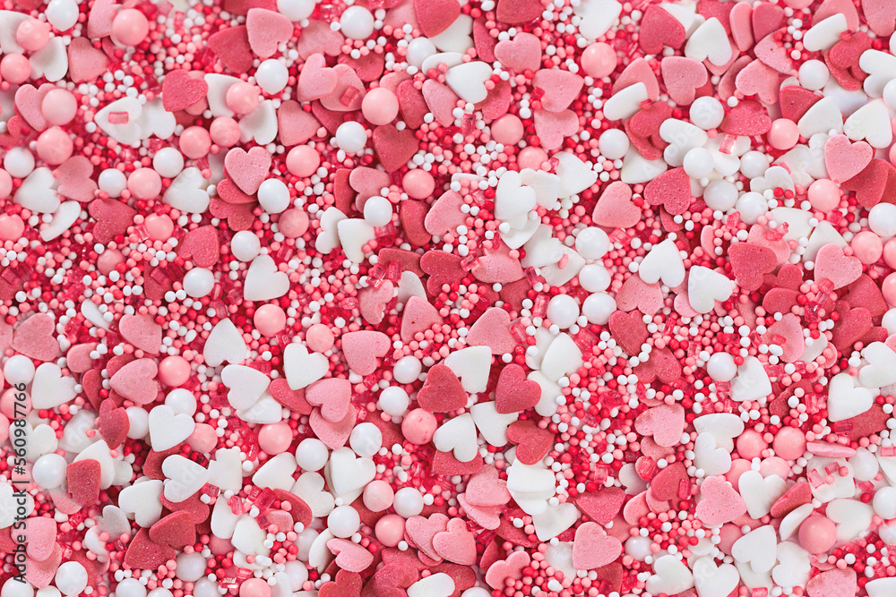 Pink heart shaped sugar sprinkles background