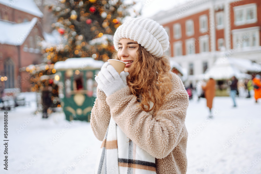 Beautiful woman playing with snow on winter street. Fashion young woman in the winter park. Christmas. Beautiful woman playing with snow on winter street. Fashion young woman in the winter park. Christmas.
