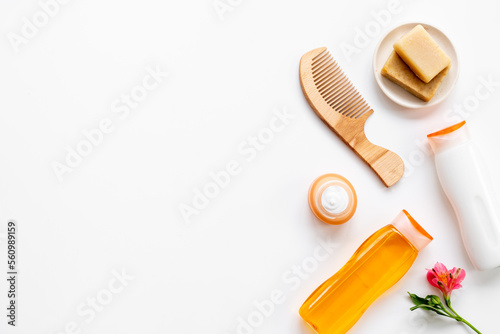 Flat lay of hair care and styling products  top view