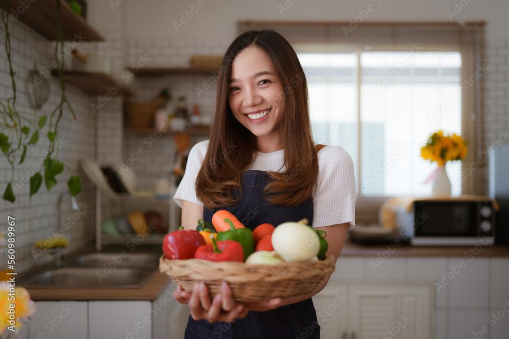 Portrait of beautiful young asian woman making salad at home. cooking food and Lifestyle moment Portrait of beautiful young asian woman making salad at home. cooking food and Lifestyle moment