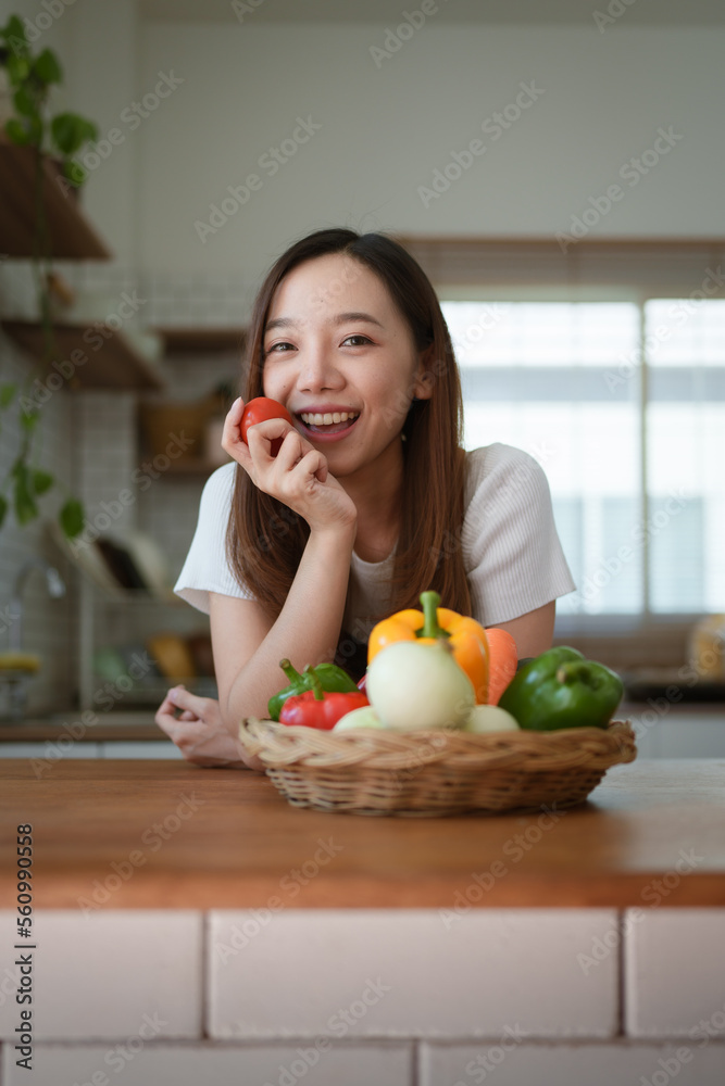 Portrait of beautiful young asian woman making salad at home. cooking food and Lifestyle moment Portrait of beautiful young asian woman making salad at home. cooking food and Lifestyle moment