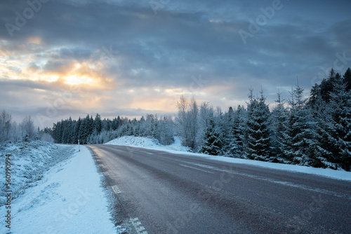 road in winter countryside at sunrise © Olha Rohulya