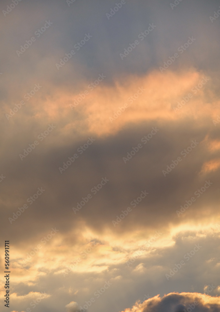 Streaks of orange clouds - vertical photo