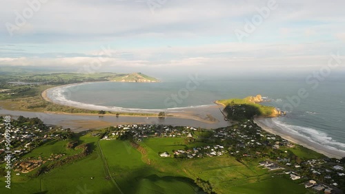 Coast of Karitane town and Huriawa peninsula, South Island, New Zealand, aerial view photo